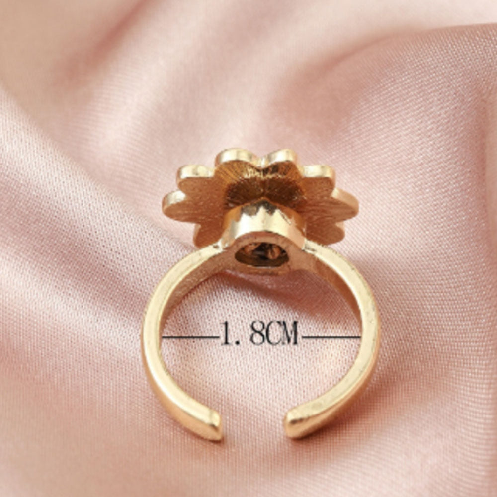 Anillo giratorio de ansiedad con forma de margarita